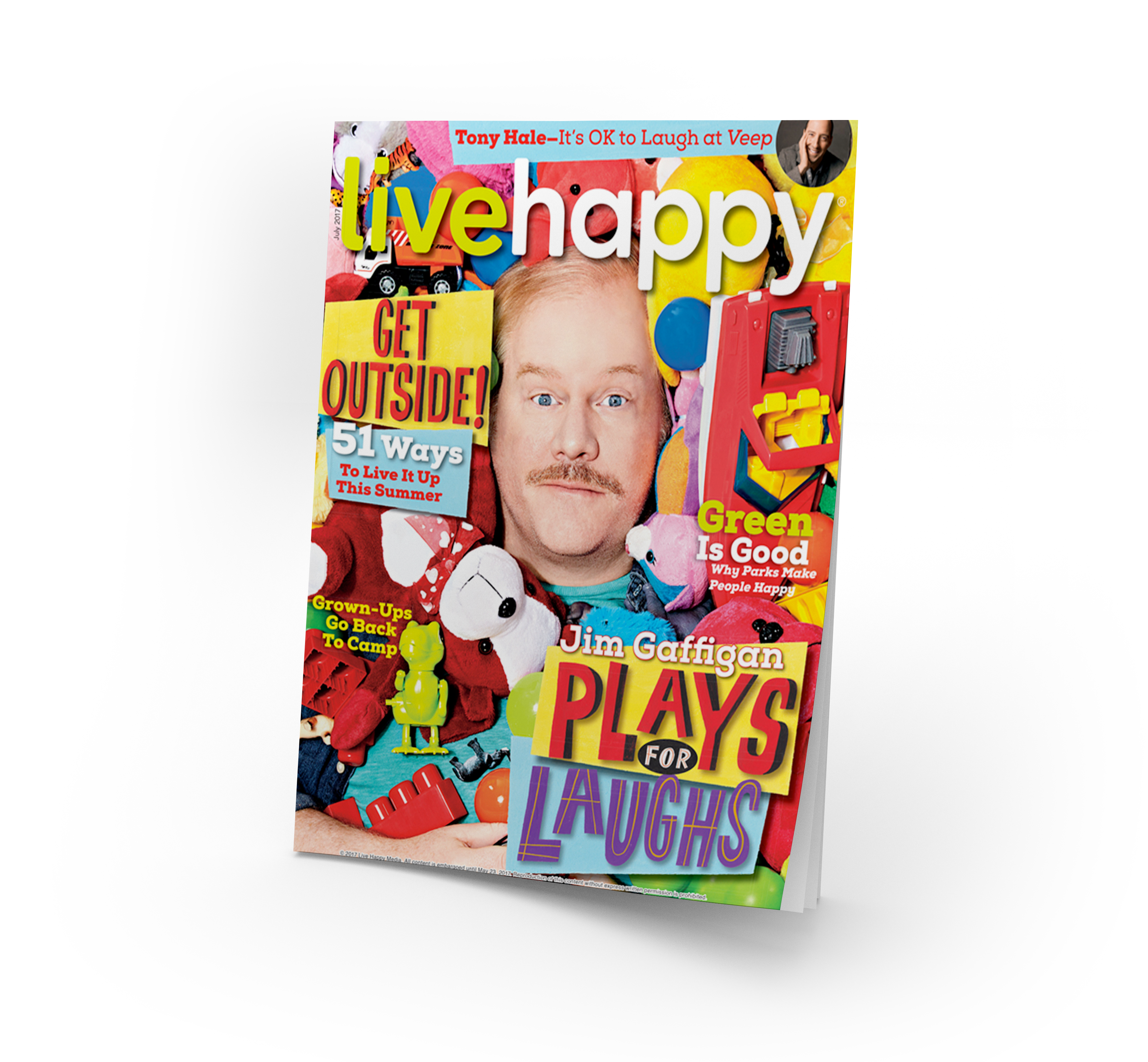 live happy magazine with man suffocating in stuffed animals